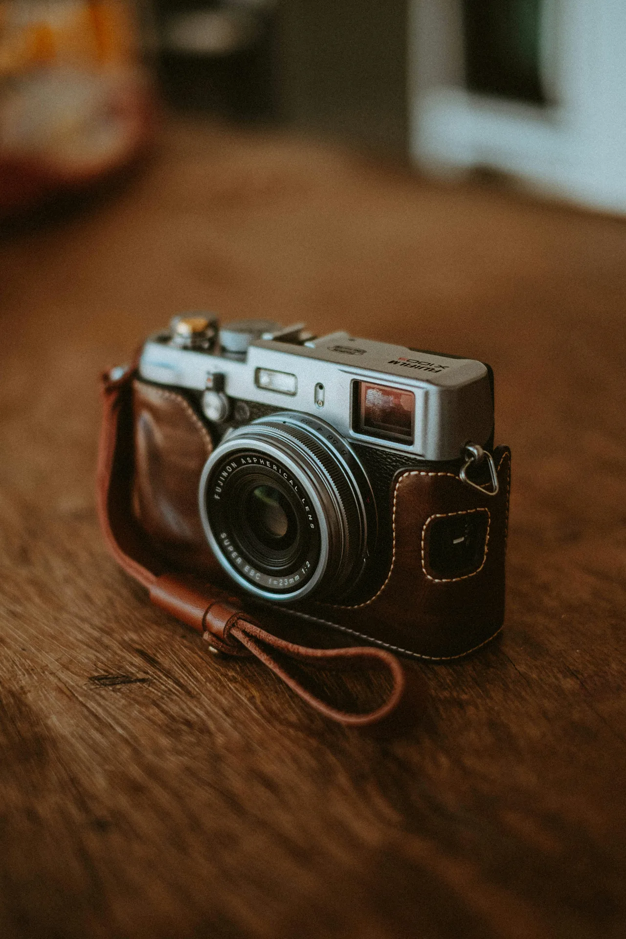 Vintage camera resting on a wooden table